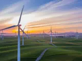 Wind turbines in action on a hilly landscape